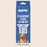 Dokitti Canine Yak Chew dog treats packaging in a blue box with a yellow Labrador retriever photo at the bottom, shown on a light beige background.