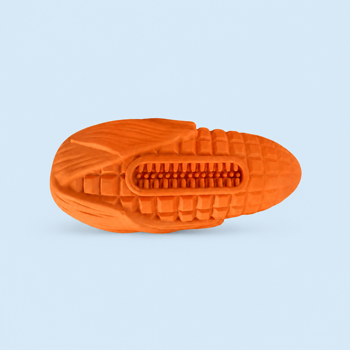 Orange shoe sole with tread pattern on a light blue background